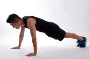 In plank position, your hands are underneath your shoulders with your spine neutral