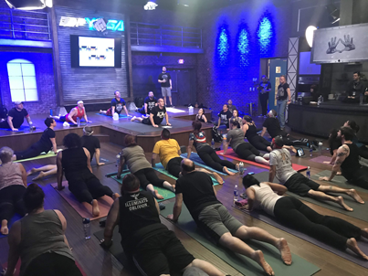Adam Bockler leads class as the DDP Yoga Performance Center